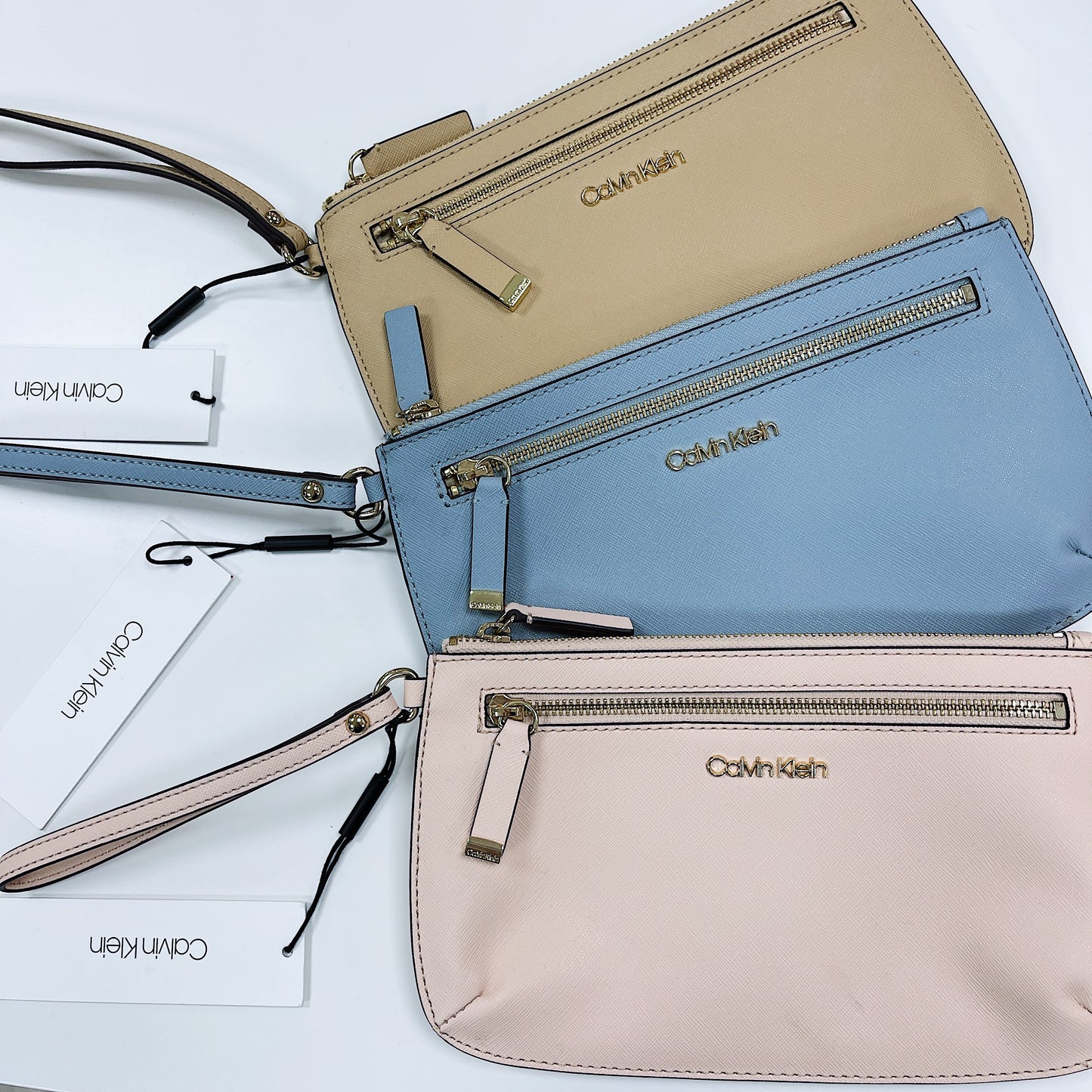 Calvin Klein Zip Around Ladies' wallet with Wristlet Studded Strap | ASOS